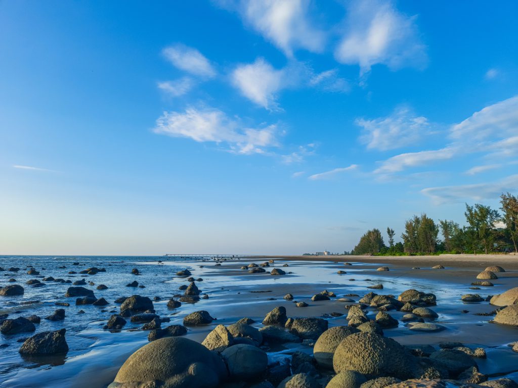 Sea waves lash line impact rock on the beach. Sea waves lash line impact rock on the beach. Seascape stones in water.