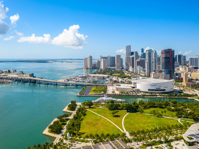 Aerial drone shot of downtown Miami Buildings on blue intercoastal waterway