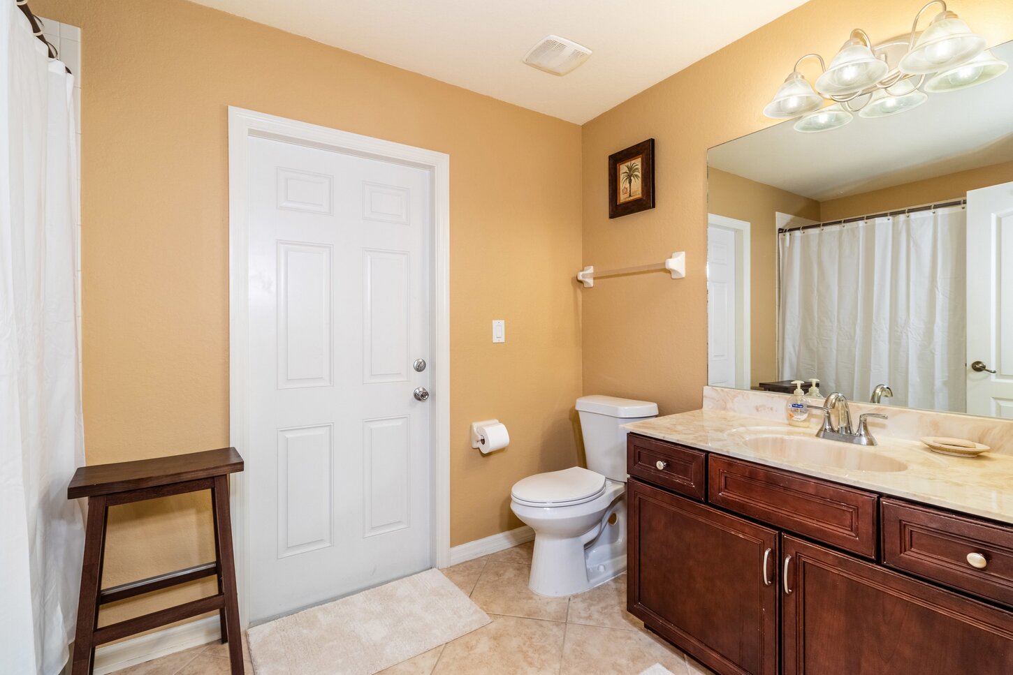 Guest bathroom with door to the pool
