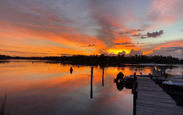 River front, less than 5 miles to the gulf, private dock & boat launch!