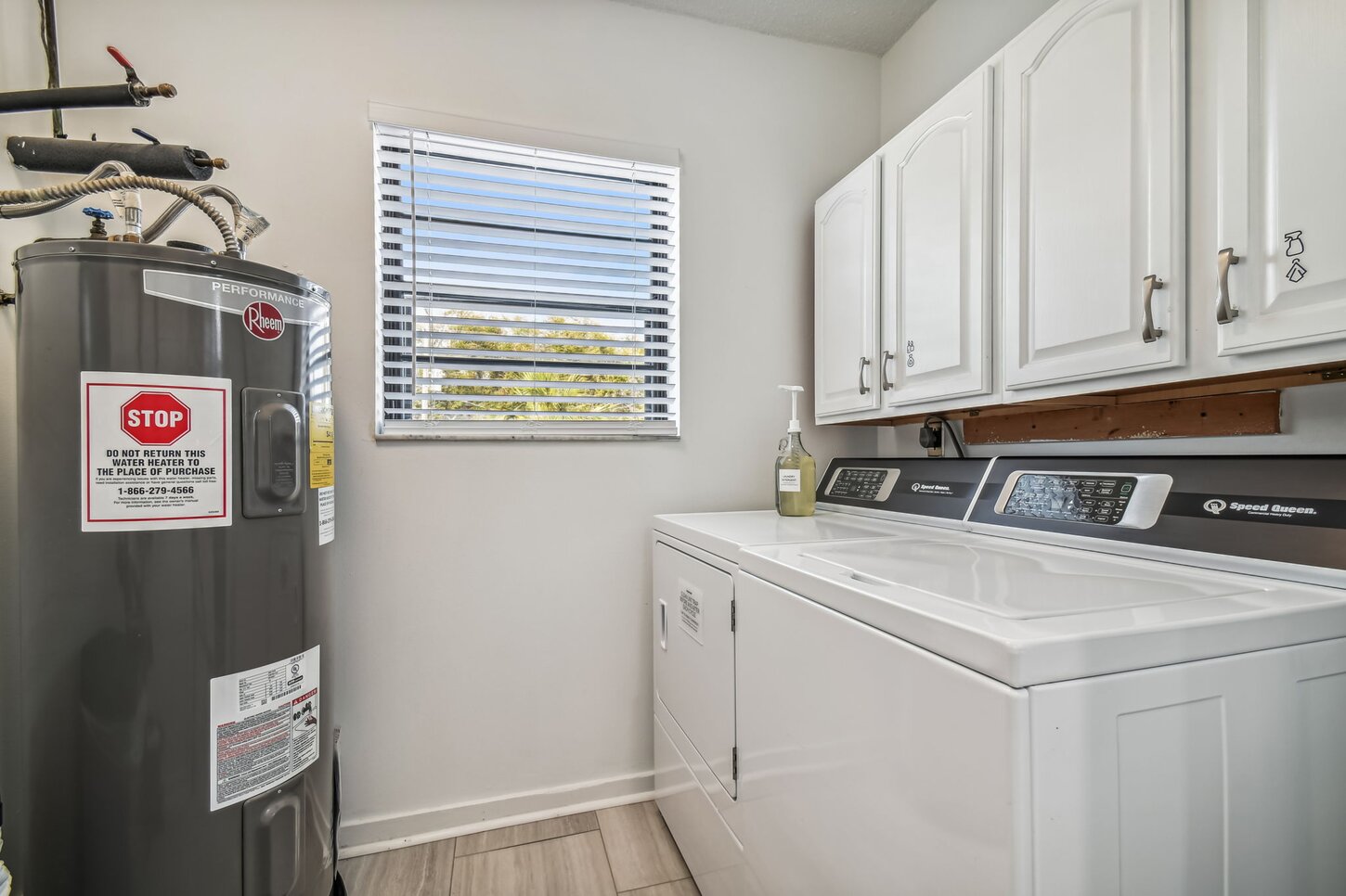 Laundry room; fullsize water heater, stateoftheart washer  dryer.