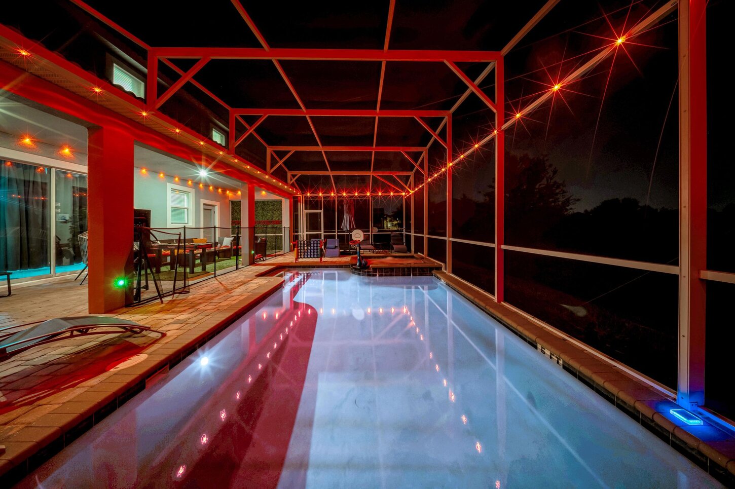  A serene outdoor escape with a sparkling pool , soothing hot tub , and stylish loungers  designed for total relaxation.