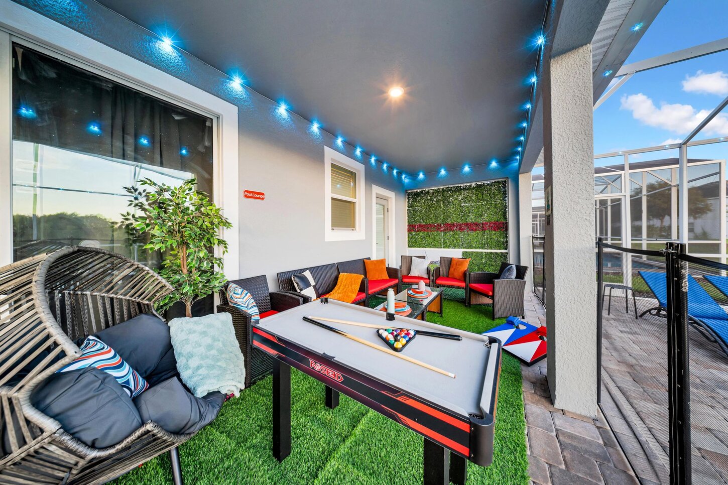Enjoy a mix of games and relaxation with  Connect 4,  axe throwing,  pool table, and cozy seating including an  egg chair,  loungers, and a  umbrella.