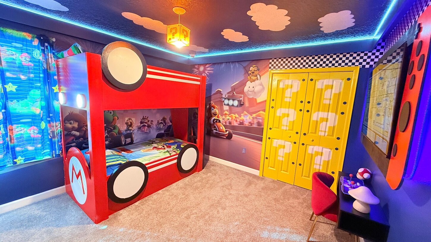  A magical Mario retreat  Featuring a Mario Kart car bed with built in lights and a custom Mario chandelier for a one of a kind experience.