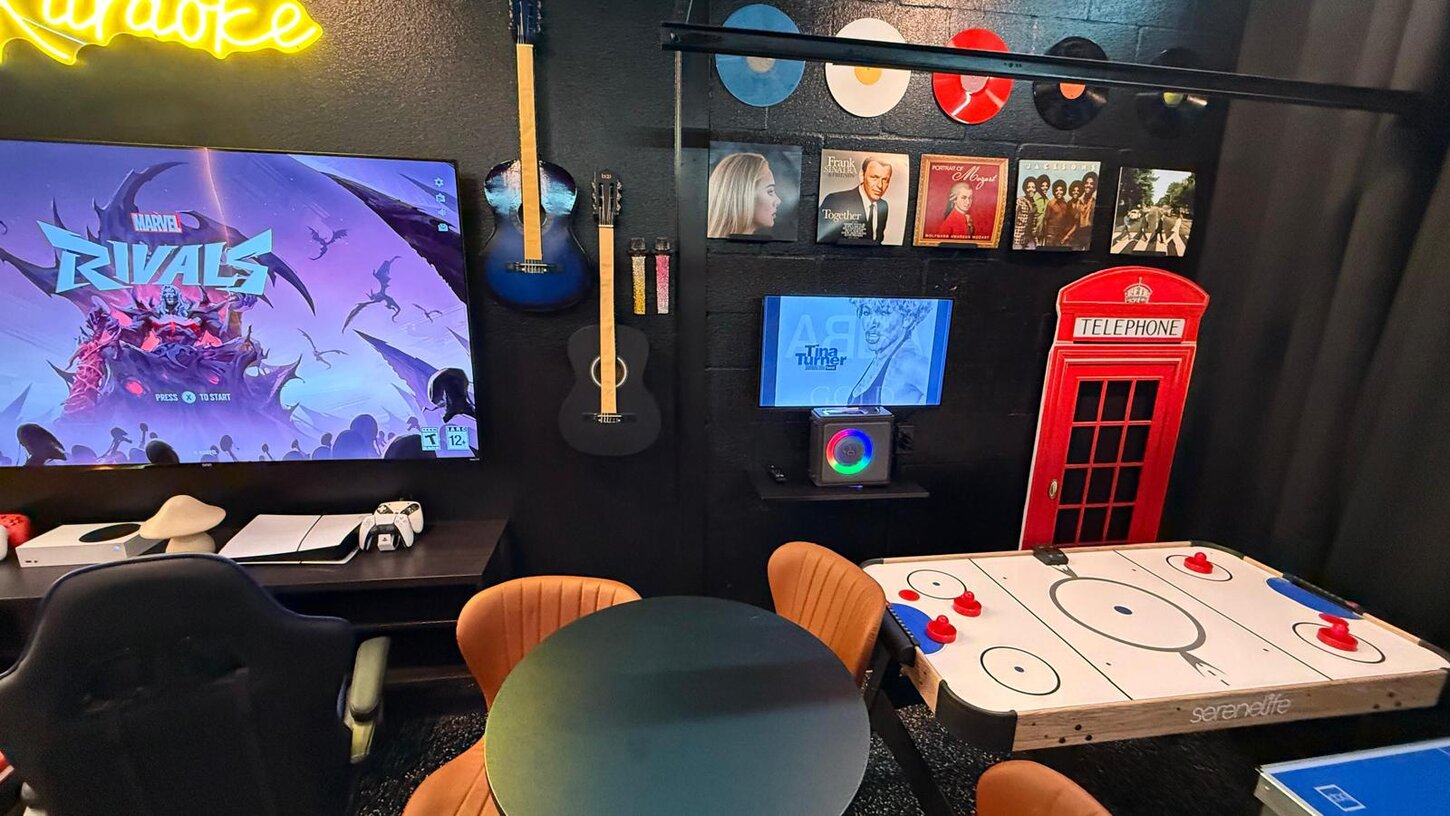 Vibrant game room with murals, cozy seating, arcades, and consoles  perfect for fun nights and Instagram, TikTok, Snapchat moments .