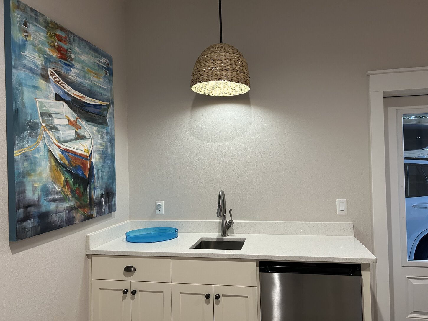 Ground floor wet bar and mini-fridge are quick access during poolside fun