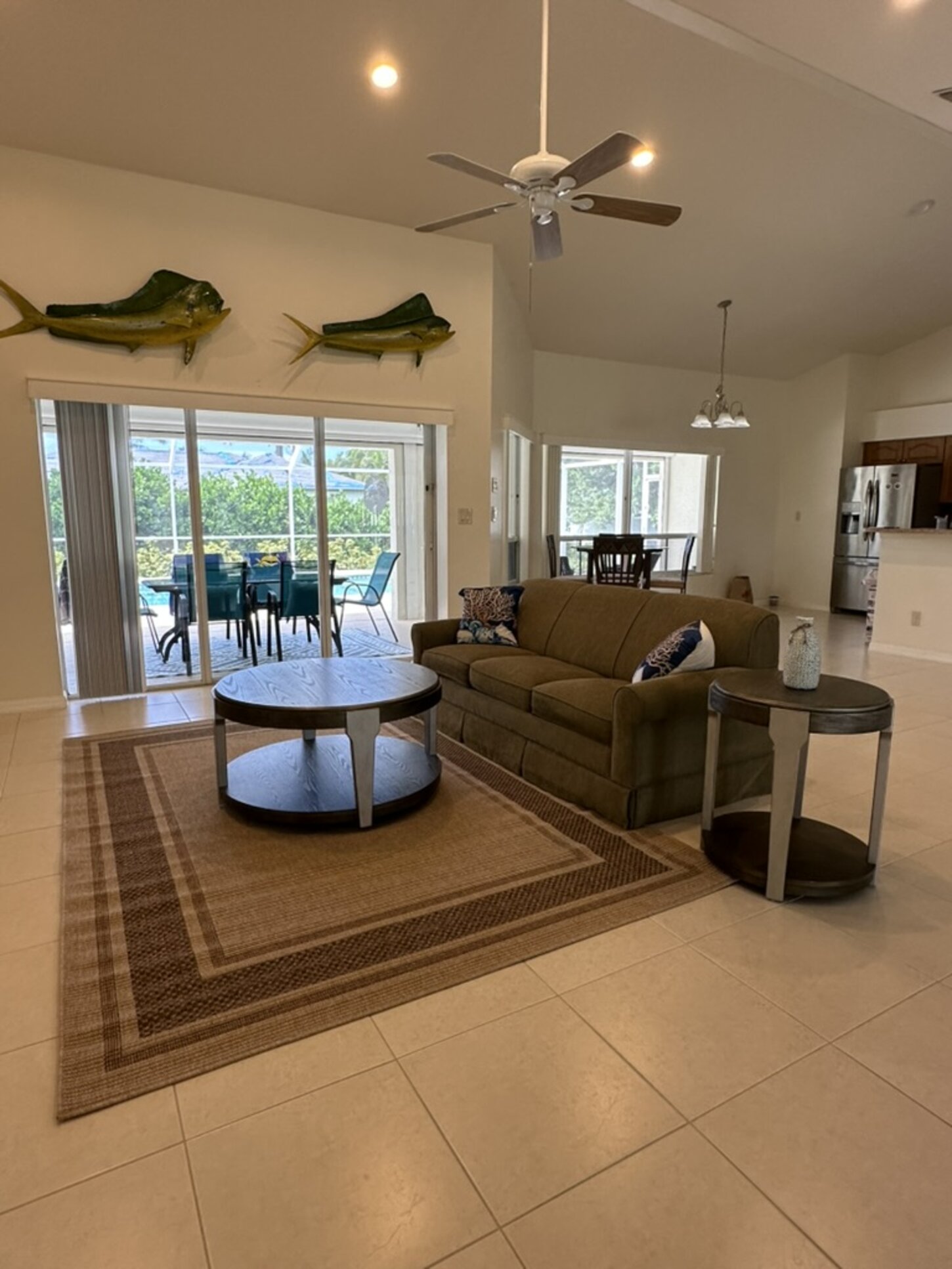 Spacious living with wide patio doors bringing the Florida sunshine inside.