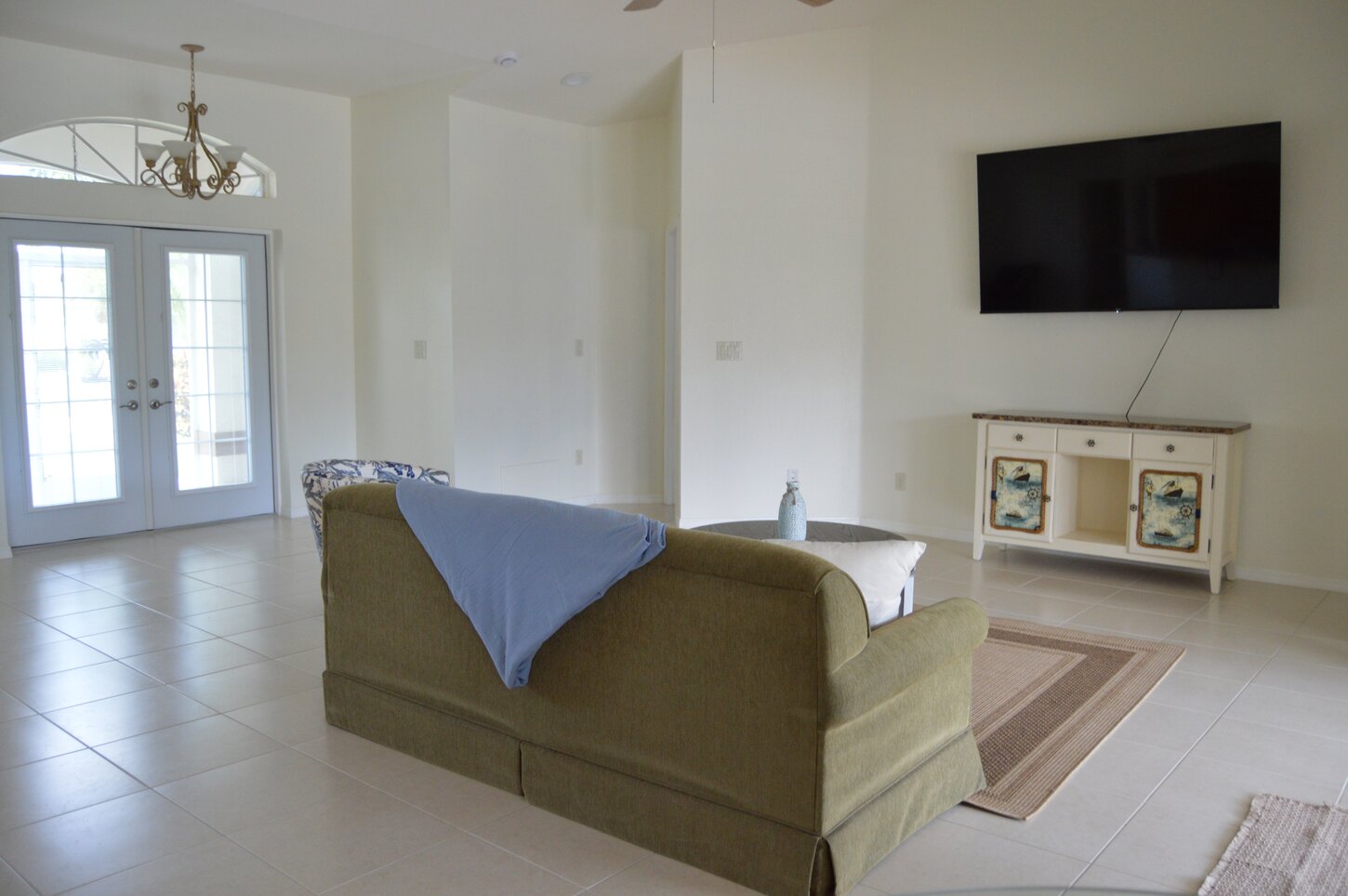 Bright, airy, and inviting—enjoy relaxing in this spacious Cape Coral living room, perfect for unwinding after a day in the Florida sun!