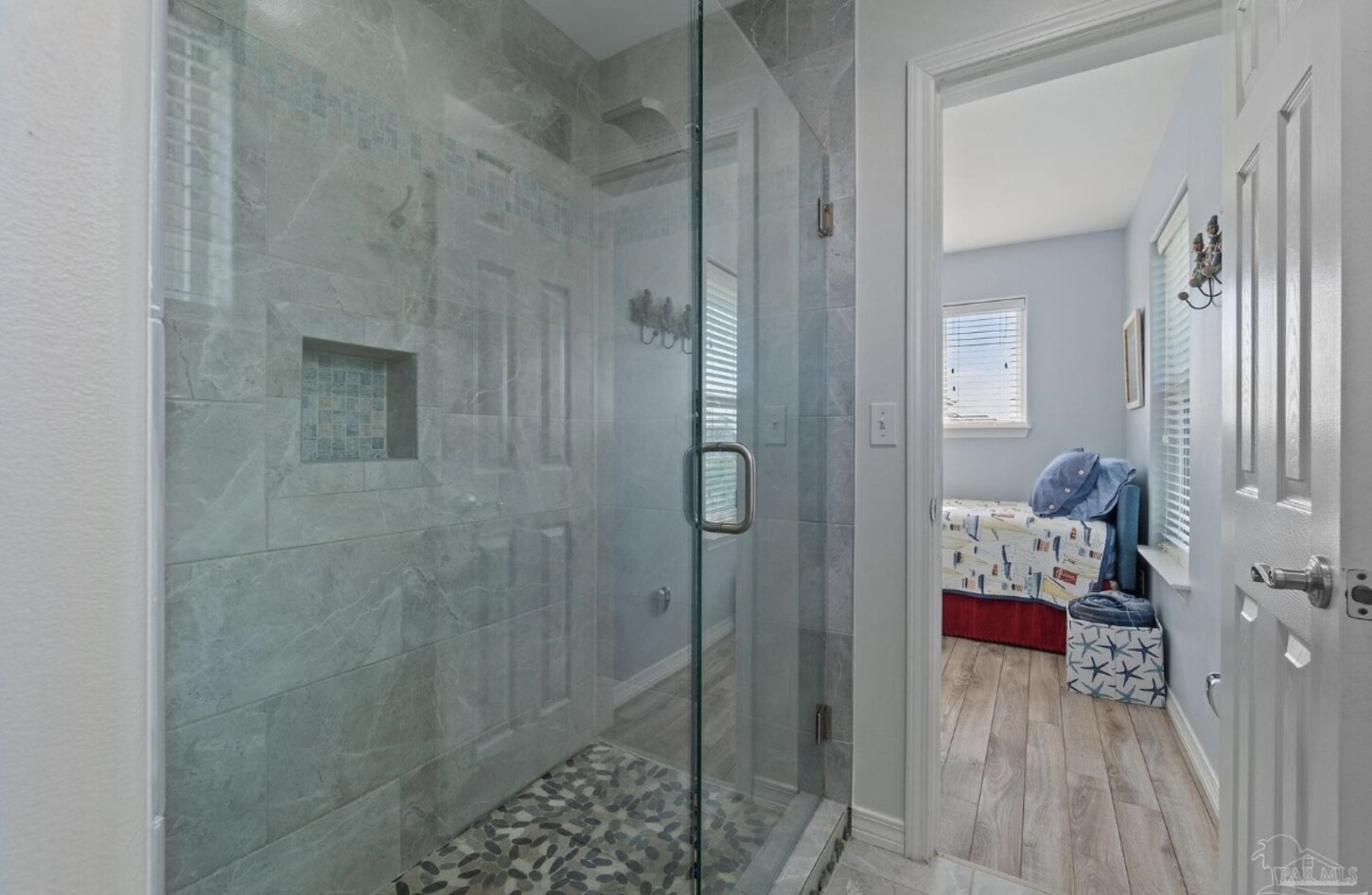 Full bathroom with tiled shower
