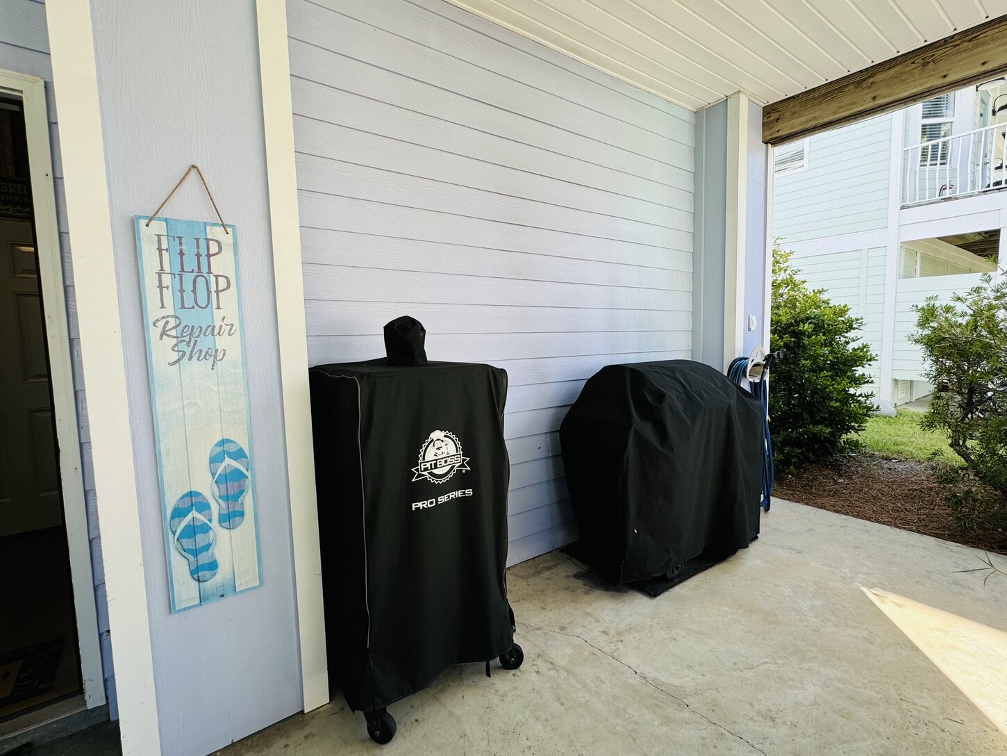 Back patio with smoker and propane grill