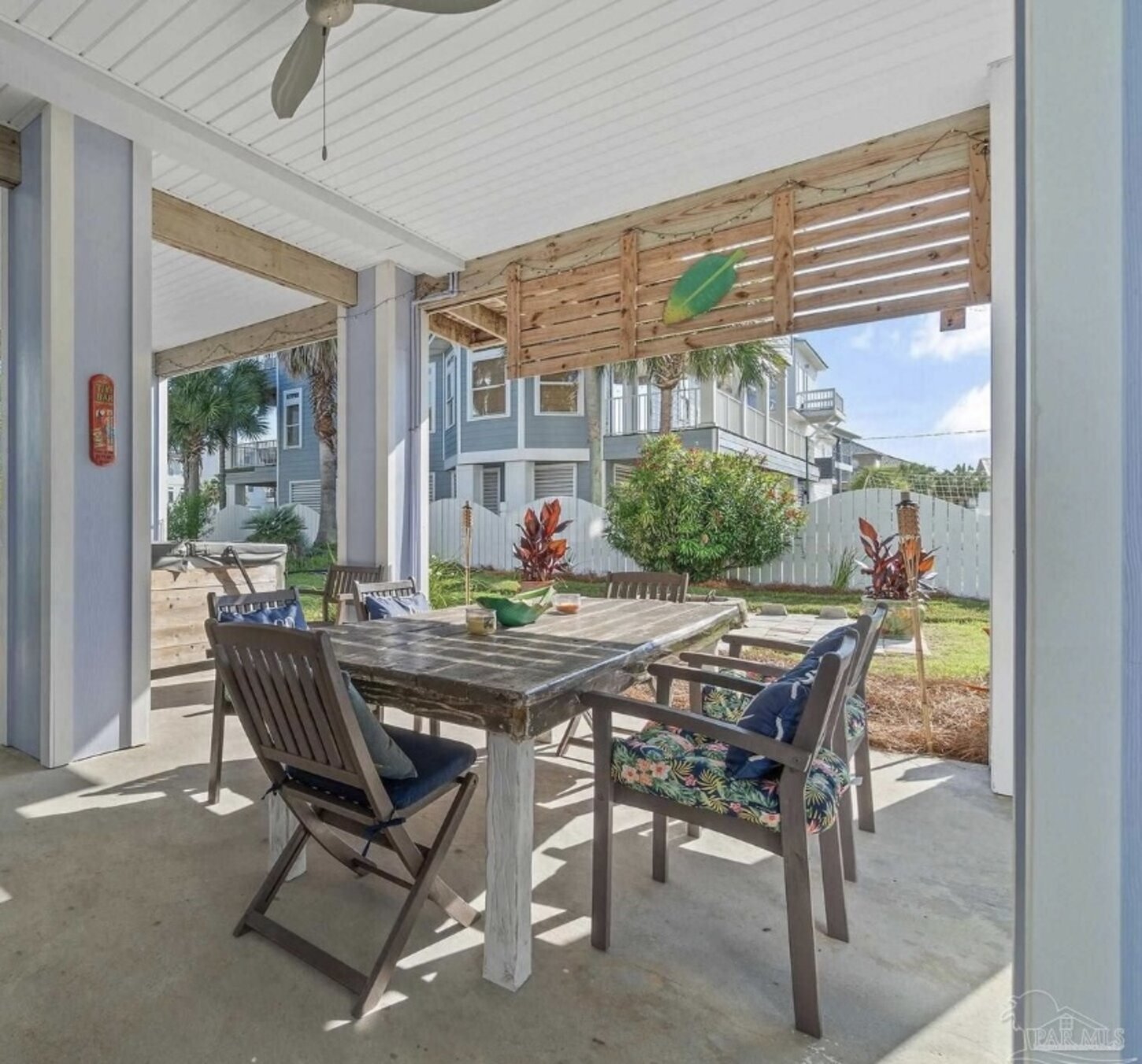 Back patio with dining table and chairs