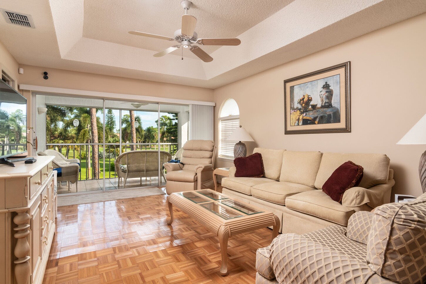 In the living room looking out to the Lani. This is a second floor unit so you have a great view looking over the pool/hot and the private golf course.
