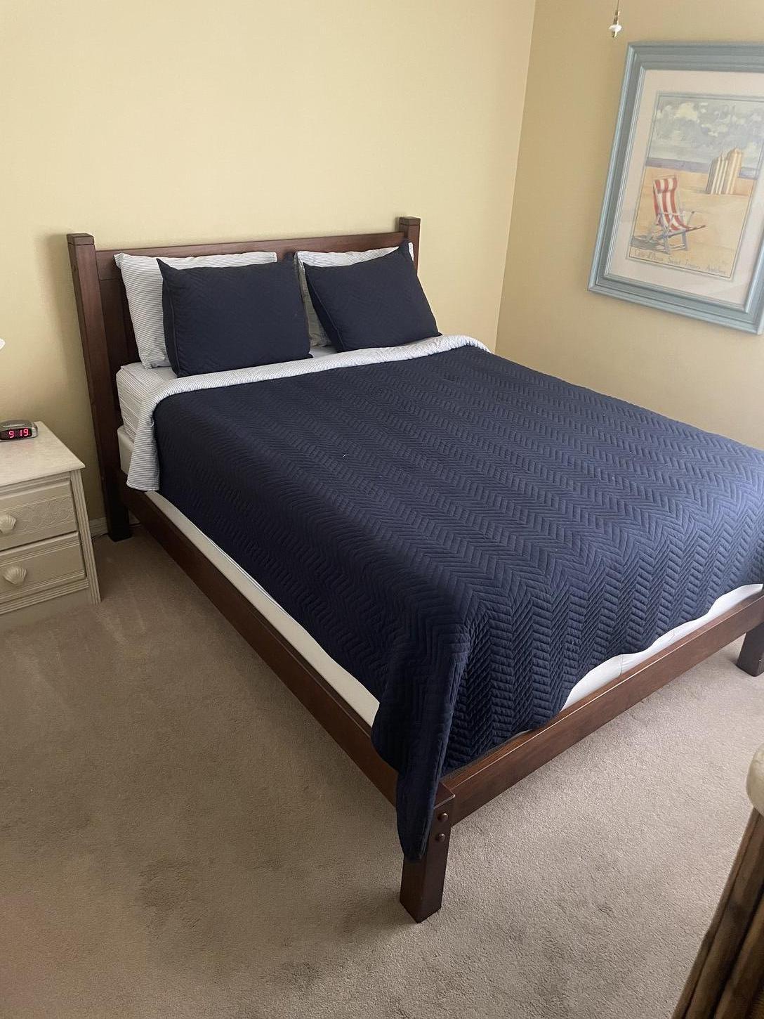 Queen size bed in guest bedroom 