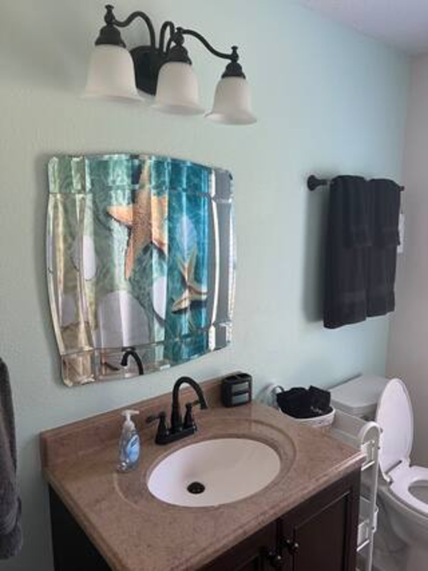 Spacious second bathroom. Bright, colorful, beautiful, and calming. Repainted 2024. 