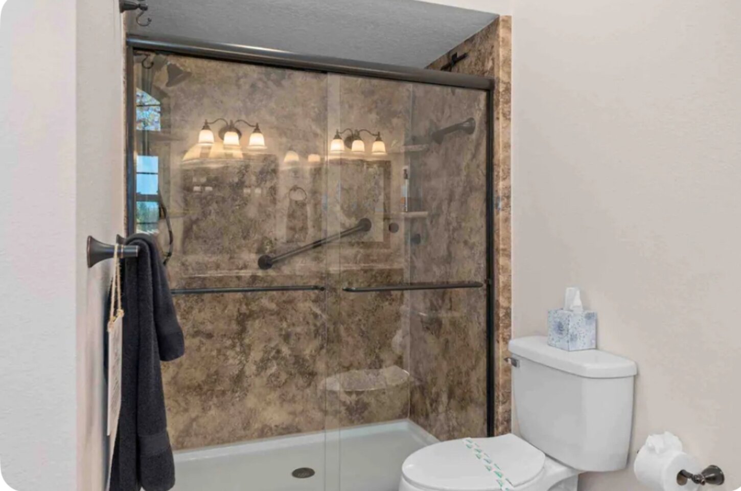 New large walk-in shower with 2-shower heads (fixed and wand). Great water pressure! 