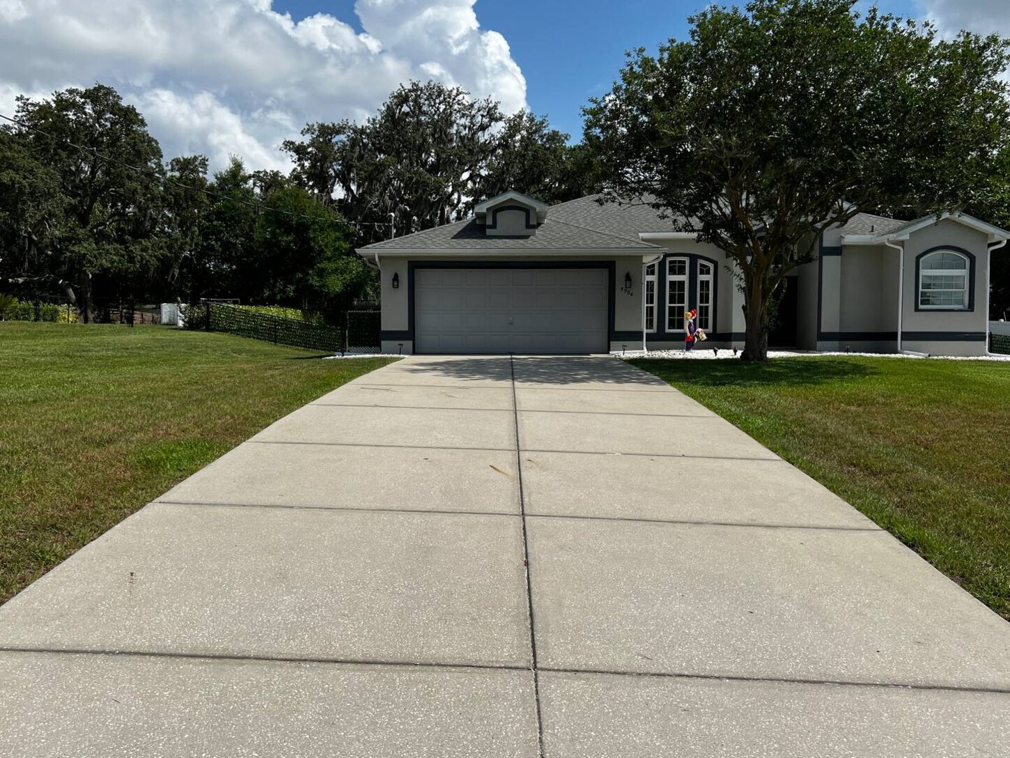 Ample 74-foot-long driveway for parking for boat trailers, toy haulers, and RVs. Easily fits 6-cars. There is a streetlight at the end of the driveway that provides a bright light all night long on your toys.