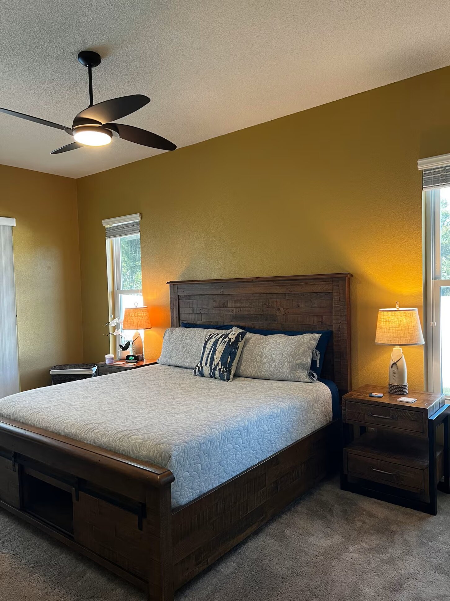 Beautiful big master bedroom, with a king size bed, that opens out into the patio. Windows and sliding glass doors are tinted to help keep the early morning light out so you can enjoy sleeping in. New mattress Dec 2024. 